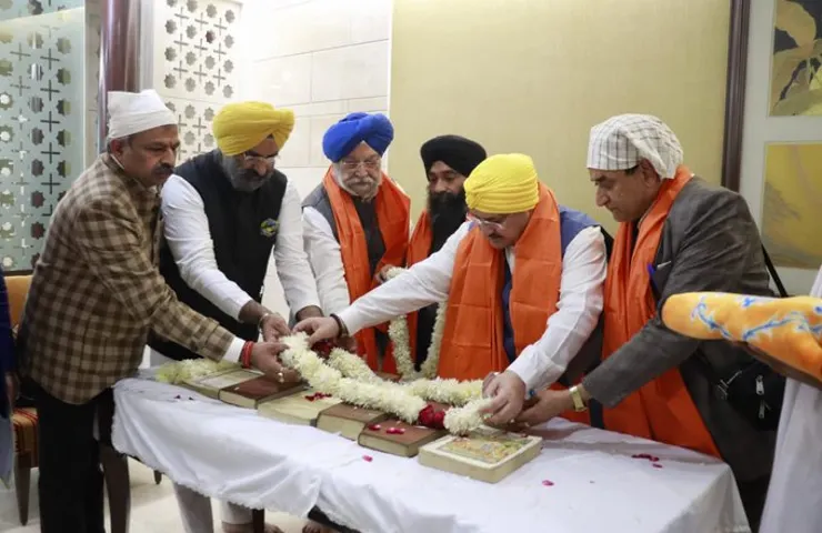 Stranded Sikhs and Hindus from Afghanistan fly back to Delhi with holy books on special flight