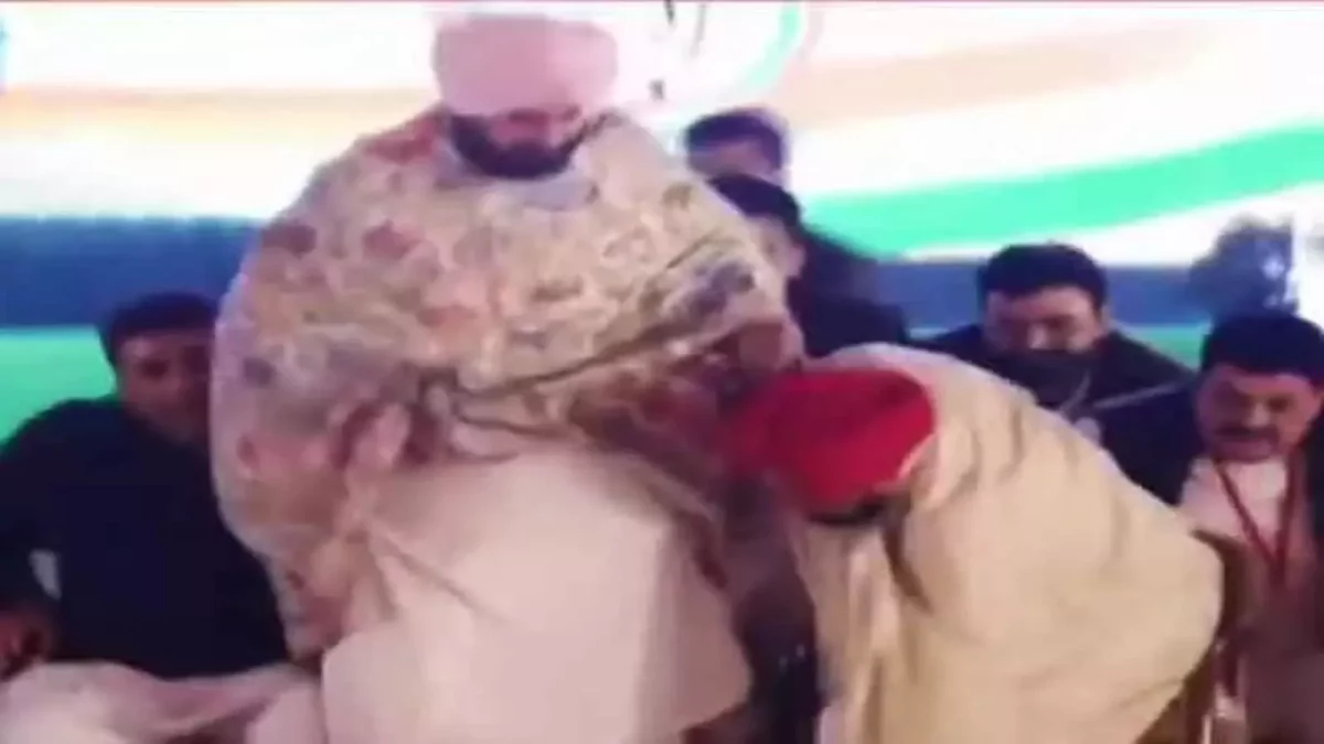 Punjab Chief Minister Channi touches Sidhu’s feet showing the Punjab Congress chief may be down but not out