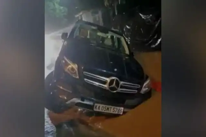 Video: Mercedes SUV stranded with two wheels up in the air on flooded Bengaluru road