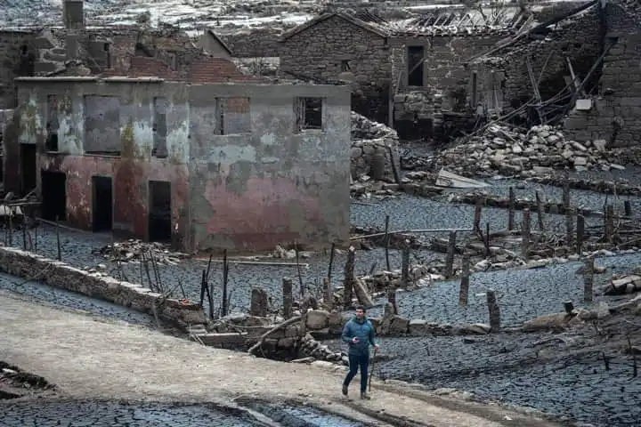 Fascinated crowds rush to see Spanish ghost village that emerges after dam water dries up in drought