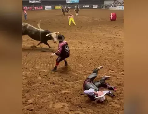 Watch: Brave Dad risks his own life to shield son from being gored to death by charging bull