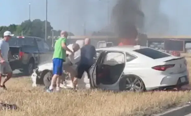 WATCH: Five Good Samaritans save man from burning car just seconds before it explodes