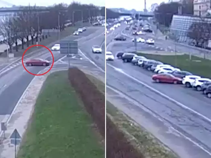 Video: Car rolls into river from parking lot as careless driver forgets to use handbrake