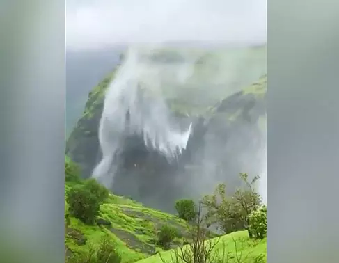Nature’s marvel: Waterfall spirals upwards instead of directly falling down at Naneghat in Maharashtra