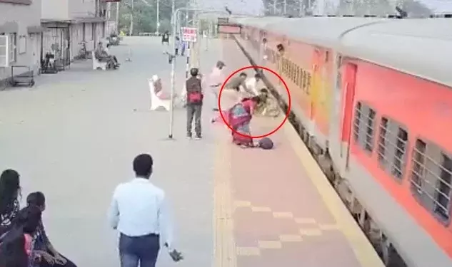 Video: Brave cop saves woman from being crushed by train