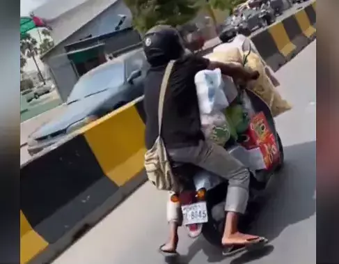WATCH: Young man in Telangana uses scooter as truck with huge load piled on it, but is on a high-risk ride