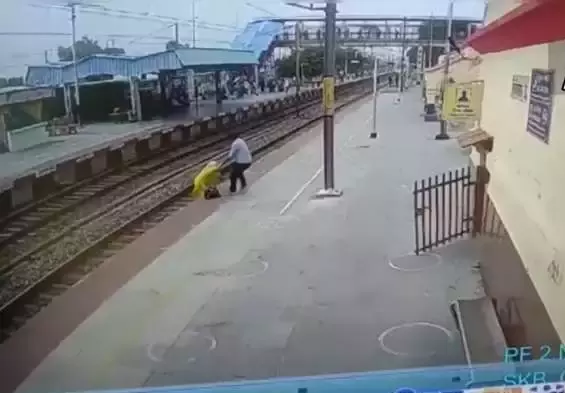 WATCH: Alert railway staffer runs to save woman from being crushed by train in nick of time