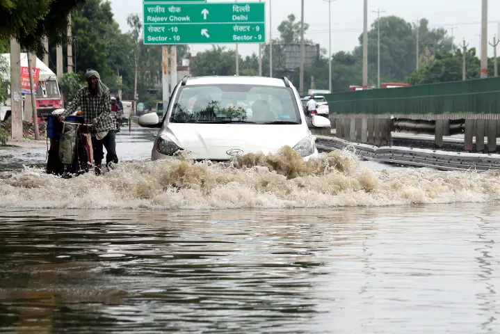 Heavy rains flood roads in Mumbai & Delhi