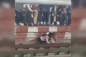 Video: Mother, son stuck between track and platform have miraculous escape as train speeds through in Karnataka