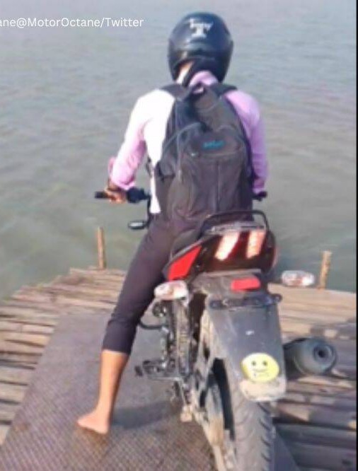Watch: Daring biker rides calmly through vast water stretch