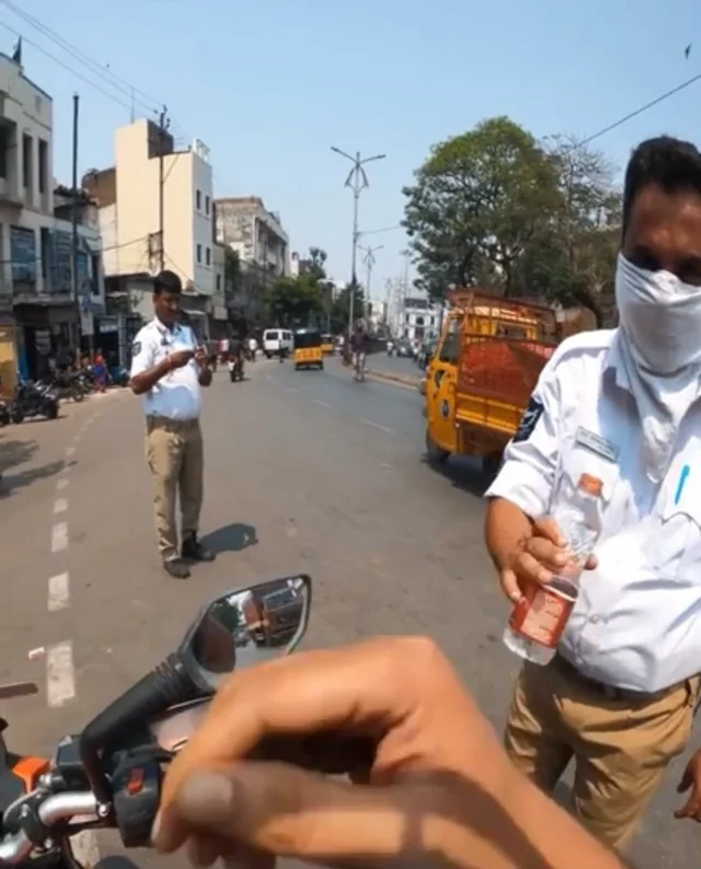 Video: Hyderabad biker wins hearts as he offers water to traffic cops in blistering heat